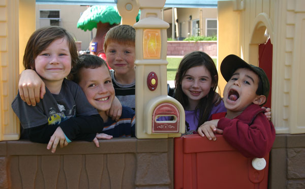 Young pals gather inside playhouse on South Courtyard